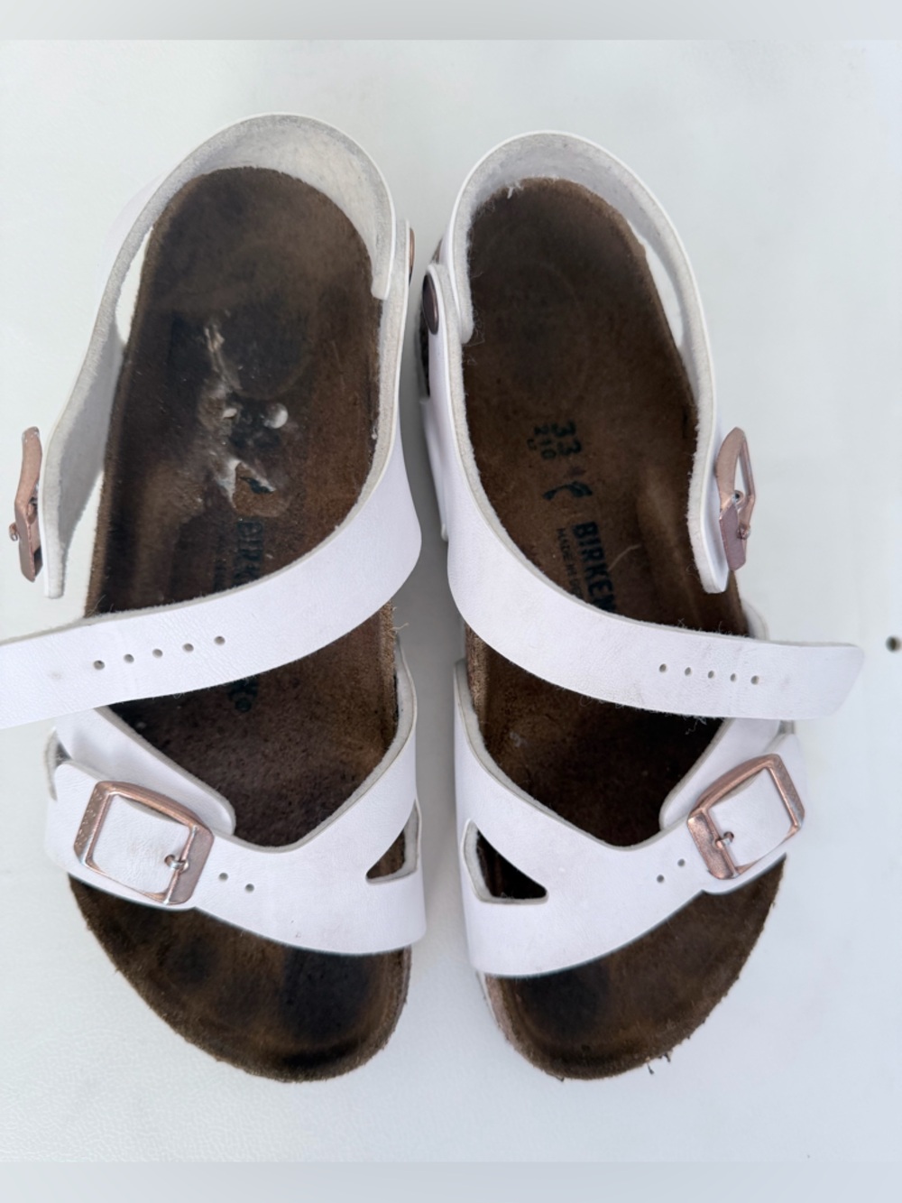 Birkenstock White Sandals with Rose Gold Buckles